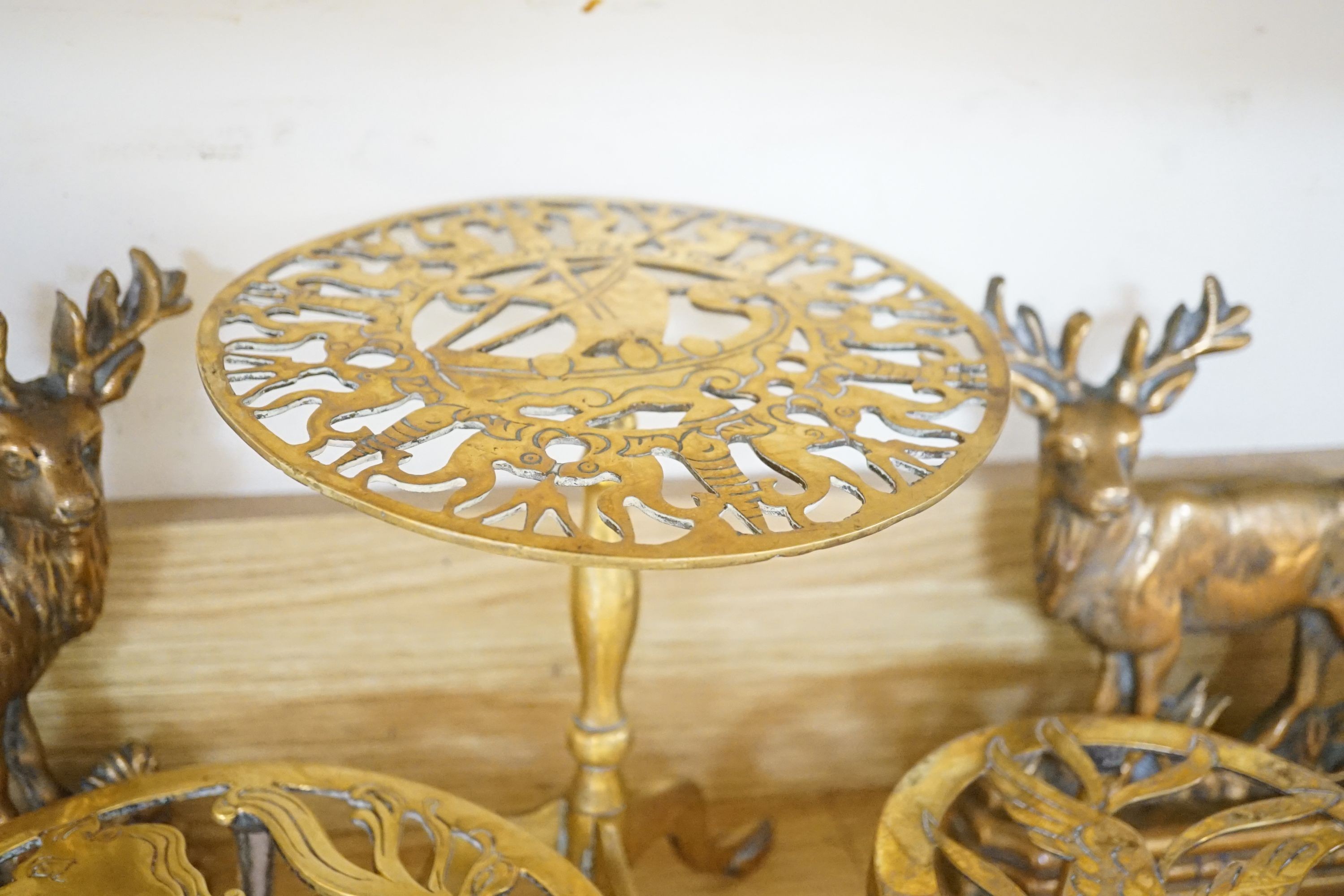 Assorted brass trivets and other brassware